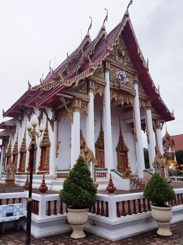 Stunning view of a traditional Thai temple showcasing intricate gold detailing and cultural architecture.