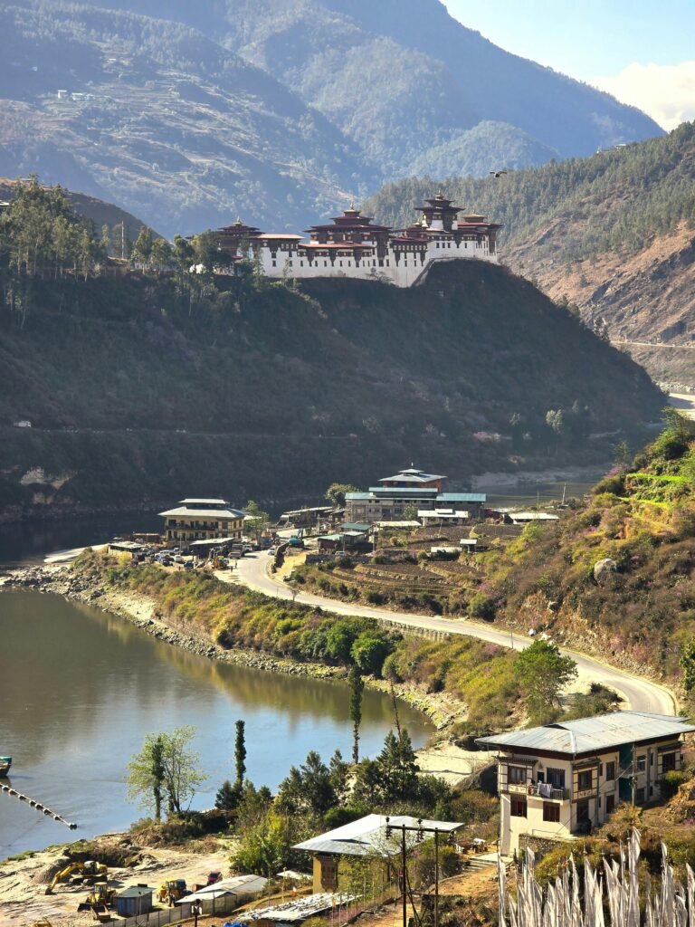 A beautiful aerial view of Punakha Dzong with a river and mountains in the background, capturing the essence of Bhutan.